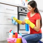 Beautiful,Woman,In,Protective,Gloves,Cleaning,Kitchen,Cabinet