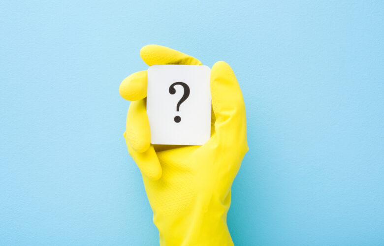 Cleaner,Hand,In,Yellow,Rubber,Protective,Glove,Showing,White,Card