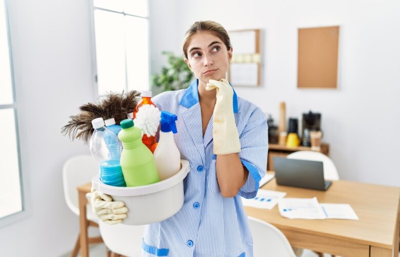 Young,Blonde,Woman,Wearing,Cleaner,Uniform,Holding,Cleaning,Products,With