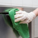 Hand,In,Protective,Glove,With,Rag,Cleaning,Kitchen,Equipment,In