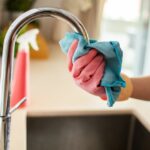 Close-up,Of,A,Young,Woman,Cleaning,Her,Kitchen